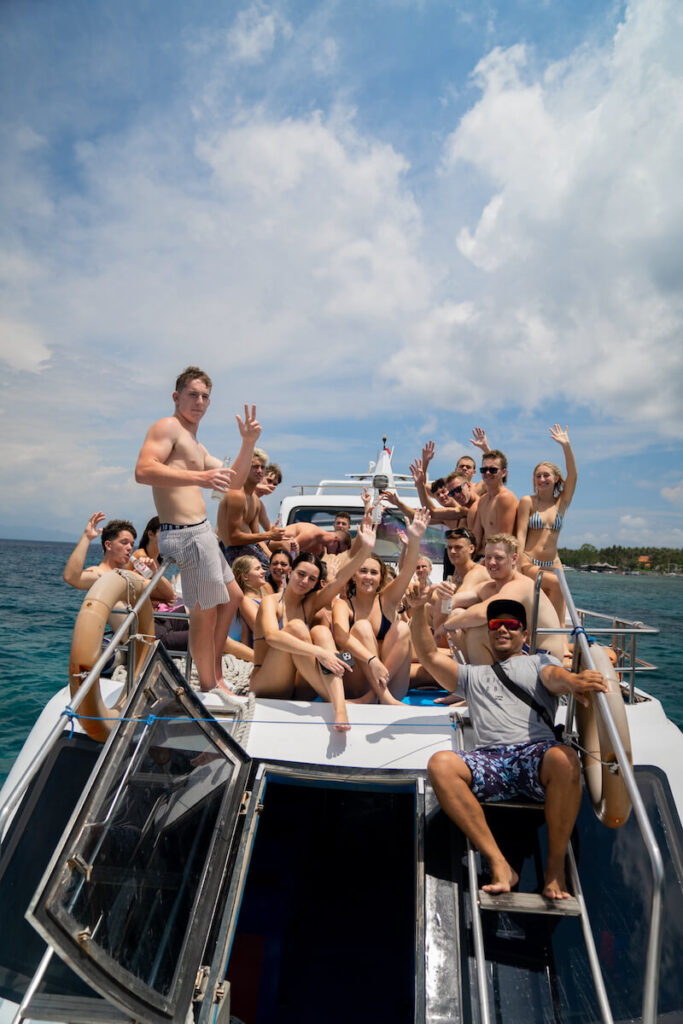 group of friends on the upper deck of the boat archipelago komodo day trip tour